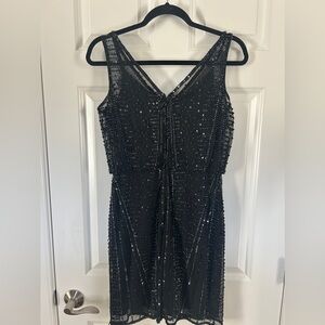 Adrianna Papell size 4, black beaded, above the knee, cocktail dress.